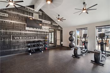fitness center with free weights and strength training and cardio equipment at Carrick Bend apartments
